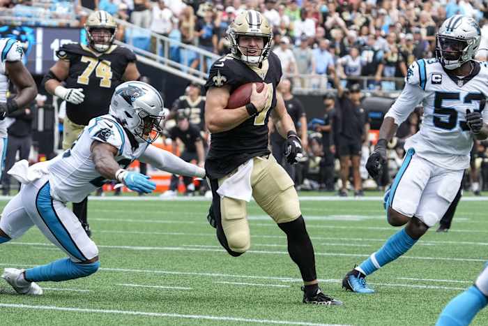 New Orleans Saints Taysom Hill (7) runs past Panthers safety Jeremy Chinn (21). Mandatory Credit: Jim Dedmon-USA TODAY Sports